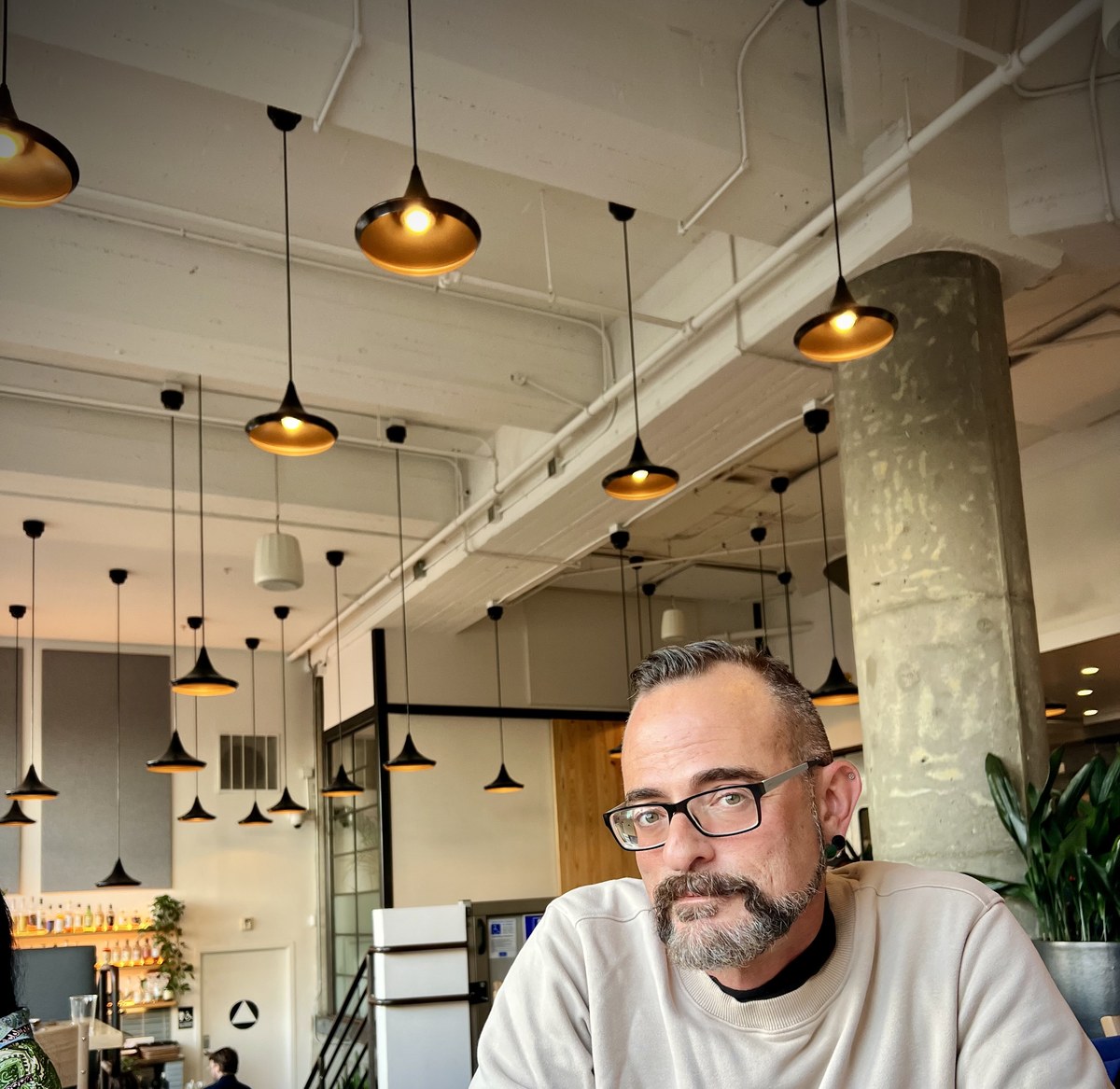 Ken — independent fragrance voice, at a café
